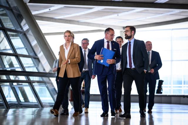 07 July 2026, Berlin: Alice Weidel (L) and Tino Chrupalla (C), co-chairs of the Alternative for Germany parliamentary group in the Bundestag, are set to make a statement on current issues ahead of the parliamentary group's meeting. The Bundestag is holding its final sitting week before the summer recess. Photo: Bernd von Jutrczenka/dpa