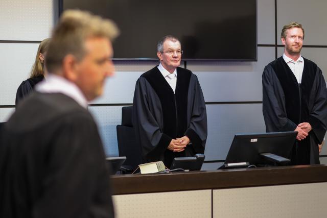 08 July 2026, North Rhine-Westphalia, Wuppertal: Presiding Judge Jochen Koetter  and Judge Clemens Schweizer take their seats as the trial against a woman who attempted to kill her husband with his favorite meal. Investigators had uncovered a murder plot in Velbert, involving a poisoned serving of beans and bacon, The woman is said to have prepared the meal with a friend of the same age from Bavaria and given it to her husband. Photo: Christoph Reichwein/dpa