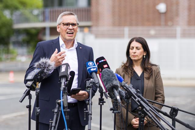 09 July 2026, Lower Saxony, Wolfsburg: Chair of the General and Group Works Council of Volkswagen AG Daniela Cavallo (R) and IG Metall regional director for Lower Saxony and Saxony-Anhalt and chief negotiator for the VW in-house collective bargaining agreement Thorsten Groeger speak to media representatives at the Sandkamp gate of the VW plant following the IG Metall rally. On the day of the Volkswagen AG Supervisory Board meeting in Wolfsburg, IG Metall is organizing information and protest events nationwide at numerous company locations. Photo: Moritz Frankenberg/dpa