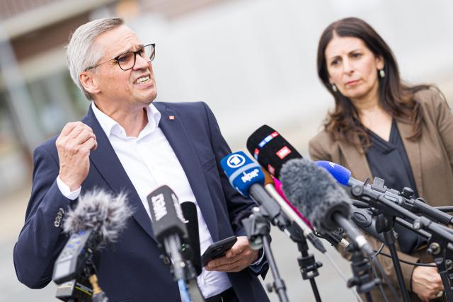 09 July 2026, Lower Saxony, Wolfsburg: Chair of the General and Group Works Council of Volkswagen AG Daniela Cavallo (R) and IG Metall regional director for Lower Saxony and Saxony-Anhalt and chief negotiator for the VW in-house collective bargaining agreement Thorsten Groeger speak to media representatives at the Sandkamp gate of the VW plant following the IG Metall rally. On the day of the Volkswagen AG Supervisory Board meeting in Wolfsburg, IG Metall is organizing information and protest events nationwide at numerous company locations. Photo: Moritz Frankenberg/dpa