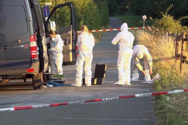 09 July 2026, Hesse, Huenfelden: Forensic investigators prepare to examine the scene after a man allegedly attacked his 76-year-old mother during an argument and set her on fire, according to police. The woman died at the scene from her injuries, police said. Photo: Sascha Ditscher/dpa