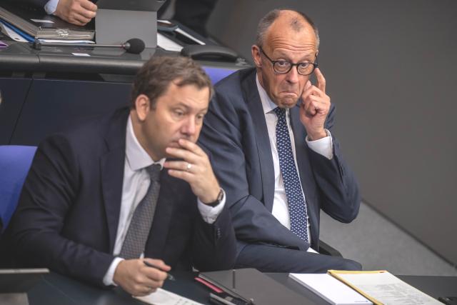 10 July 2026, Berlin: German Chancellor Friedrich Merz (CDU) watches the debate in the Bundestag alongside Lars Klingbeil (left, SPD), Federal Minister of Finance, during the last session before the summer recess, at which the vote on the black-red coalition's healthcare austerity package is among the items on the agenda. Photo: Michael Kappeler/dpa