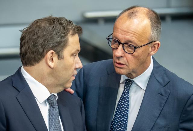 10 July 2026, Berlin: Germa Chancellor Friedrich Merz (CDU) speaks with Lars Klingbeil (left, SPD), German Minister of Finance, in the Bundestag during the last session before the summer recess, at which the vote on the black-red coalition's healthcare austerity package is among the items on the agenda. Photo: Michael Kappeler/dpa