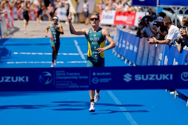 11 July 2026, Hamburg: Australian triathlete Matthew Hauser on his way to win the men's sprint race at the ITU World Triathlon Series/World Championship, comprising a 750-metre swim, a 20-kilometre bike ride and a five-kilometre run. Photo: Philipp Szyza/dpa
