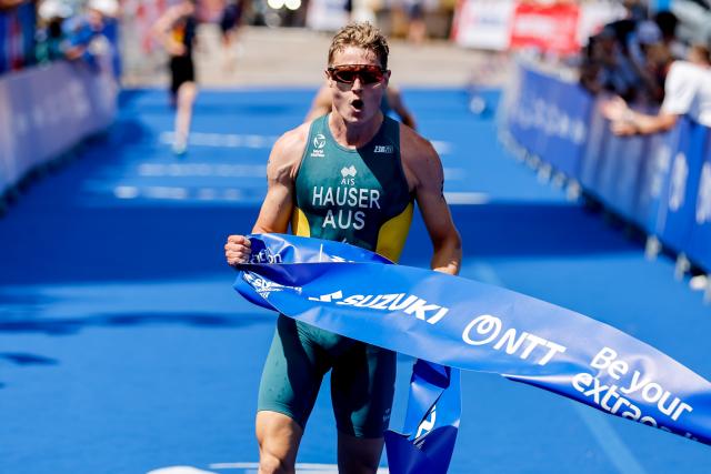 11 July 2026, Hamburg: Australian triathlete Matthew Hauser wins the men's sprint race at the ITU World Triathlon Series/World Championship, comprising a 750-metre swim, a 20-kilometre bike ride and a five-kilometre run. Photo: Philipp Szyza/dpa