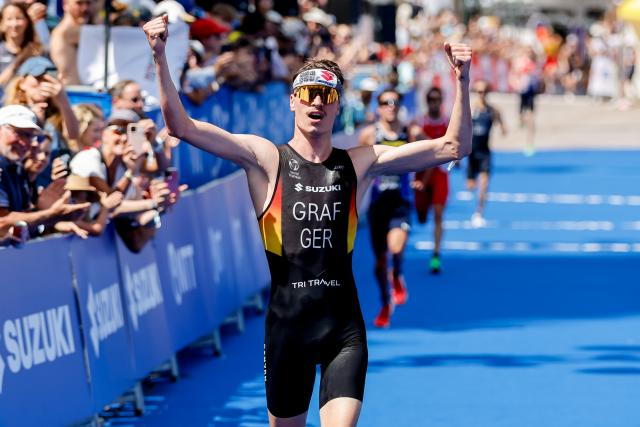 11 July 2026, Hamburg: German triathlete Henry Graf finishes third in the men's sprint race at the ITU World Triathlon Series/World Championship, comprising a 750-metre swim, a 20-kilometre bike ride and a five-kilometre run. Photo: Philipp Szyza/dpa