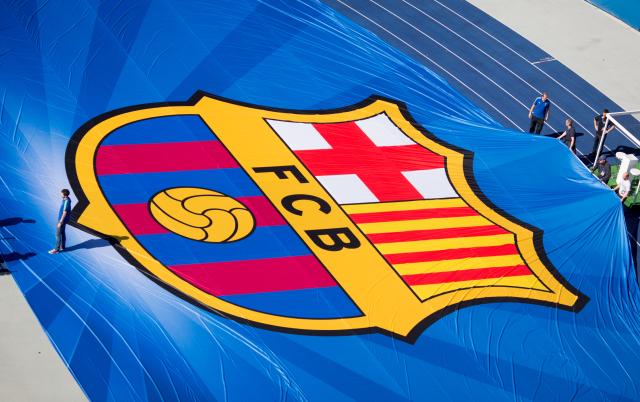 FILED - 04 June 2015, Berlin: FILE PHOTO - The emblem of FC Barcelona is stretched for the 2015 UEFA Champions League Final in the Olympic stadium in Berlin. Photo: picture alliance / dpa
