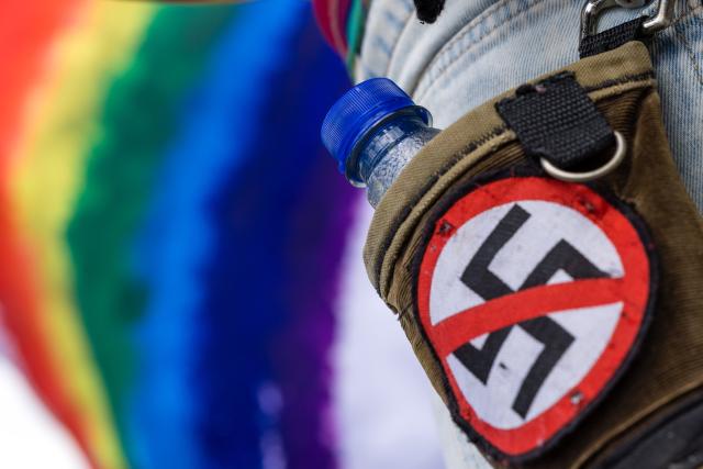 11 July 2026, Brandenburg, Cottbus: A crossed-out swastika patch is seen on a participant's bag during a demonstration marking the 18th Christopher Street Day (CSD) in Cottbus and Lower Lusatia. Photo: Frank Hammerschmidt/dpa