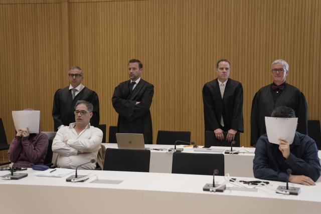13 July 2026, Bavaria, Munich: (L-R) The defendants are seated in the courtroom during the trial of an Iraqi couple convicted of enslaving two Yazidi girls and of membership in the terrorist organization Islamic State (IS) at the Higher Regional Court in Munich. Photo: Ehsan Monajati/dpa