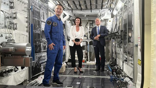 13 July 2026, North Rhine-Westphalia, Cologne: (L-R) ESA astronaut Matthias Maurer, Germany's Minister of Research Dorothee Baer, DLR Executive Board member Walther Pelzer and Markus Ogorek, Deputy Director of the Adenauer School of Government, inspect a Columbus training module at the European Astronaut Centre (EAC) on the grounds of the German Aerospace Center (DLR) in Cologne, Germany. The Columbus module is the European laboratory of the International Space Station (ISS). Photo: Jörg Ratzsch/dpa