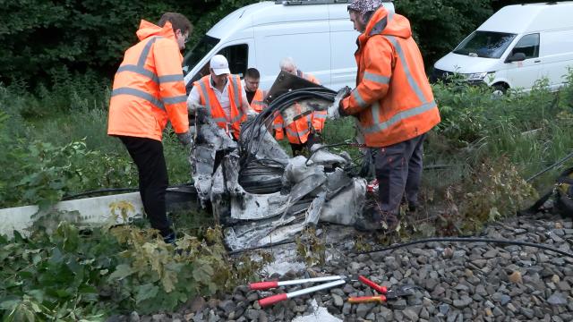 14 July 2026, Lower Saxony, Neu Wulmstorf: A repair crew works on a railway distribution box following a suspected arson attack in Neu Wulmstorf. Train services between Hamburg and Cuxhaven were suspended after a fire damaged the installation overnight. Photo: Sebastian Peters/NEWS5/dpa
