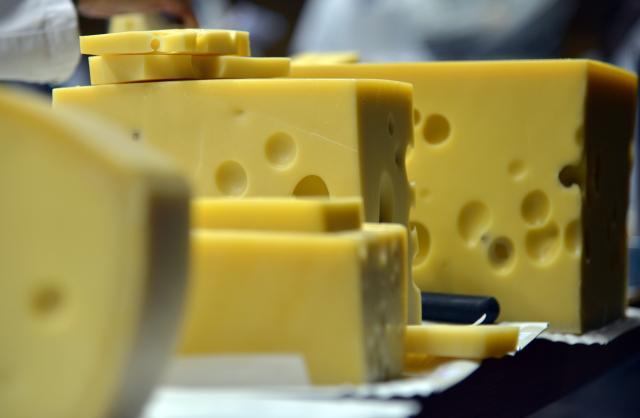 FILED - 09 May 2017, Rhineland-Palatinate, Trier: FILE PHOTO - Emmentaler cheese is displayed during a cheese tasting. Photo: Harald Tittel/dpa