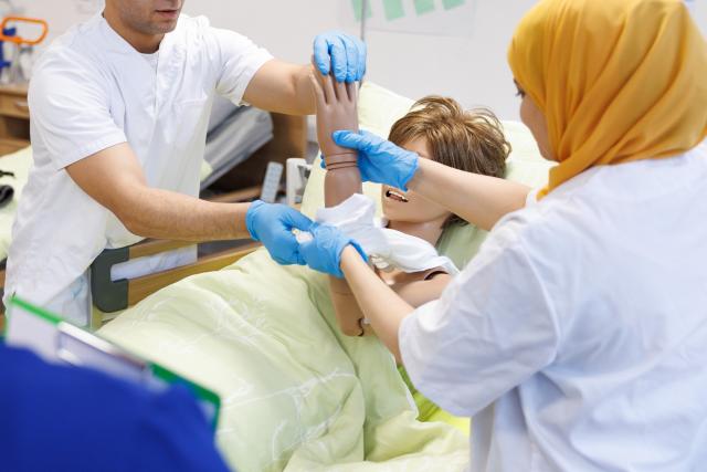 FILED - 24 January 2024, North Rhine-Westphalia, Petershagen: FILE PHOTO - Foreign nursing professionals are taking part in hands-on training on personal care as part of a recognition program. Photo: Friso Gentsch/dpa