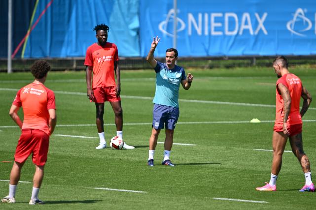 14 July 2026, North Rhine-Westphalia, Leverkusen: Bayer Leverkusen head coach Carles Martinez Novell instructs players during the team's first summer training session of the season at the BayArena Photo: Federico Gambarini/dpa - IMPORTANT NOTICE: Bundesliga and DFB regulations prohibit any use of photographs as image sequences and/or quasi-video.