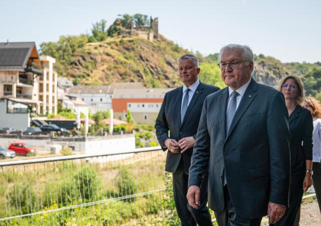 14 July 2026, Rhineland-Palatinate, Altenahr: Frank-Walter Steinmeier, German President, Gordon Schnieder, Minister-President of Rhineland-Palatinate, and Sabine Baetzing-Lichtenthäler, Minister of Labor, Social Affairs, Women, Family, and Youth, are walking along the banks of the Ahr during the opening of the exhibition "We AHR strong. Five Years, A New Perspective." Photo: Hannes P. Albert/dpa