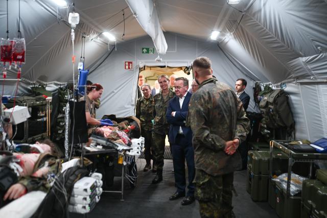 14 July 2026, Lower Saxony, Leer: German Defense Minister Boris Pistorius inspects a mobile hospital operated by the the "Ostfriesland" Rapid Medical Response Force Command. Photo: Lars Penning/dpa