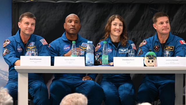 14 July 2026, Bremen: NASA astronauts Reid Wiseman, Victor Glover, Christina Koch, and Jeremy Hansen, attend an event about the Artemis II mission hosted by NASA and Airbus. Photo: Carmen Jaspersen/dpa
