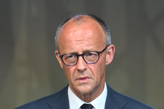 14 July 2026, Rhineland-Palatinate, Bad Neuenahr-Ahrweiler: German Chancellor Friedrich Merz, speaks at the central memorial ceremony marking the fifth anniversary the 2021 European floods, in the Ahr Valley on the market square. During the flood disaster in the summer of 2021, 136 people died in Rhineland-Palatinate, 135 of them in the Ahr Valley. Photo: Boris Roessler/dpa