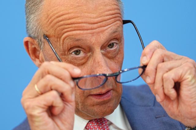 15 July 2026, Berlin: German Chancellor Friedrich Merz adjusts his glasses during the traditional summer press conference at the Federal Press Conference Centre in Berlin, Photo: Michael Kappeler/dpa
