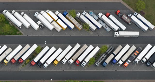 FILED - 01 May 2014, Brandenburg, Michendorf: FILE PHOTO - An aerial view of the full truck parking lot at the Michendorf highway rest stop. Photo: Ralf Hirschberger/dpa-Zentralbild/dpa