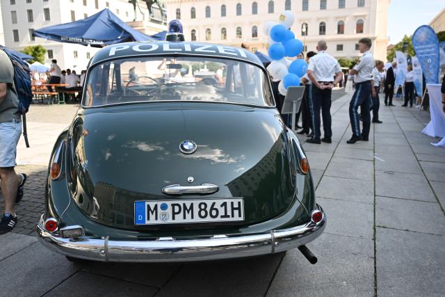 18 July 2026, Bavaria, Munich: A BMW 501 "Baroque Angel" is displayed at Wittelsbacherplatz in Munich, ahead of the opening of the "80 Years of the Bavarian Police" celebrations. Photo: Felix Hörhager/dpa
