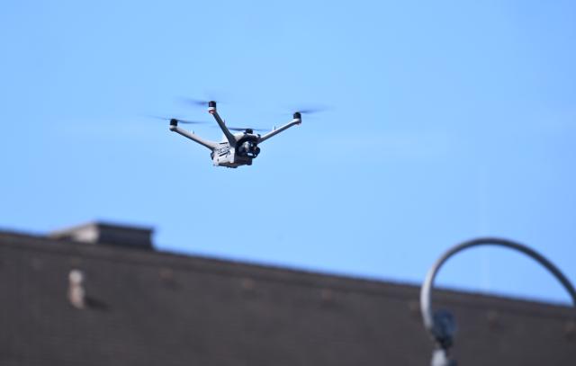 18 July 2026, Bavaria, Munich: A drone flies over Ludwigsstraße during a drone demonstration at the "80 Years of the Bavarian Police" celebration. Photo: Felix Hörhager/dpa