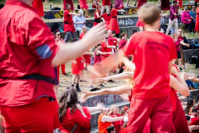 18 July 2026, Berlin: Participants dance during the "Wuthering Heights Day" event in Goerlitzer Park in Berlin. The global event sees people dressed in red reenact the choreography from the music video for Kate Bush's 1978 song "Wuthering Heights." Photo: Christoph Soeder/dpa