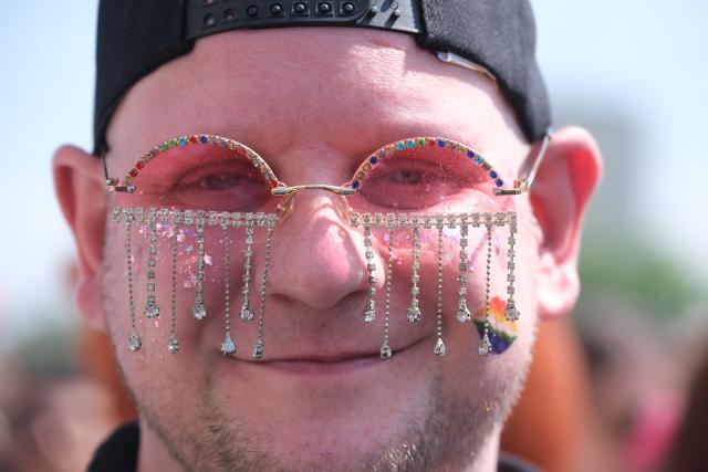 18 July 2026, Saxony, Leipzig: A participant takes part in the Christopher Street Day (CSD) parade in Leipzig. Around 20,000 people were expected to attend the annual event. Photo: Sebastian Willnow/dpa