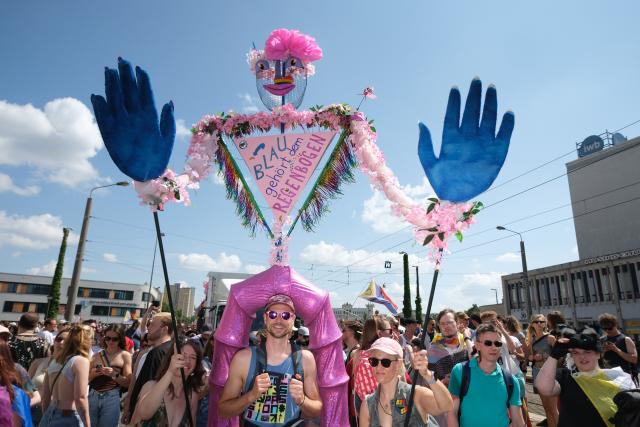 18 July 2026, Saxony, Leipzig: Participants take part in the Christopher Street Day (CSD) parade in Leipzig. Around 20,000 people were expected to attend the annual event. Photo: Sebastian Willnow/dpa