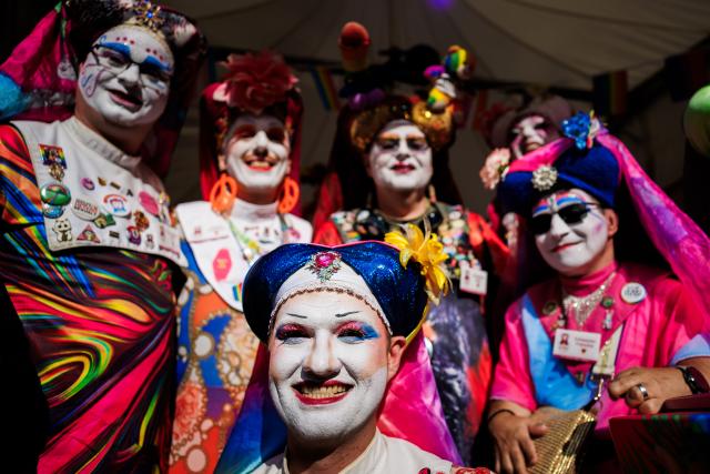 18 July 2026, Berlin: Members of the Order of the Sisters of Perpetual Indulgence pose for a group photo during the Lesbian and Gay City Festival in Berlin's Rainbow Neighbourhood around Nollendorfplatz. Photo: Christoph Soeder/dpa