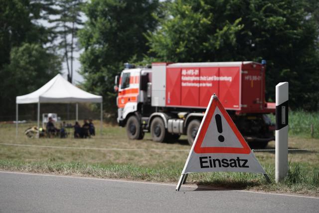 18 July 2026, Mecklenburg-Western Pomerania, Kratzeburg: An incident sign stands at the scene of a wildfire in Mueritz National Park. Photo: Manuel Genolet/dpa