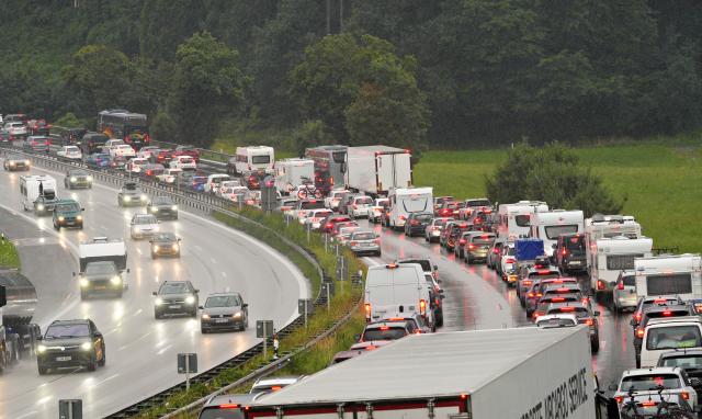 19 July 2026, Bavaria, Irschenberg: Traffic is backed up on the A8 highway toward Munich near Irschenberg following a truck accident. The closure of this major vacation route has caused long traffic jams. Photo: Uwe Lein/dpa