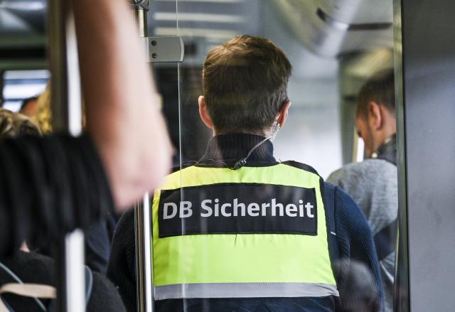 FILED - 15 June 2026, Berlin: FILE PHOTO - A German Railways (Deutsche Bahn) Security employee stands on a train in Berlin. Photo: Jens Kalaene/dpa
