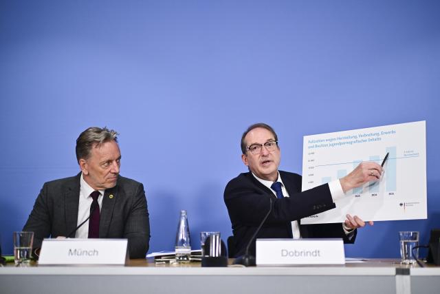 21 July 2026, Berlin: Alexander Dobrindt (R), German Minister of the Interior, points to a chart during the presentation of the 2025 Federal Report on Sexual Offenses Against Children and Adolescents, standing next to Holger Muench, President of the Federal Criminal Police Office (BKA). Photo: Sebastian Gollnow/dpa