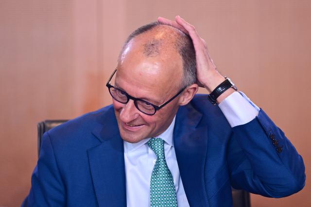 22 July 2026, Berlin: German Chancellor Friedrich Merz takes his seat before the Federal Cabinet meeting. Photo: Sebastian Gollnow/dpa