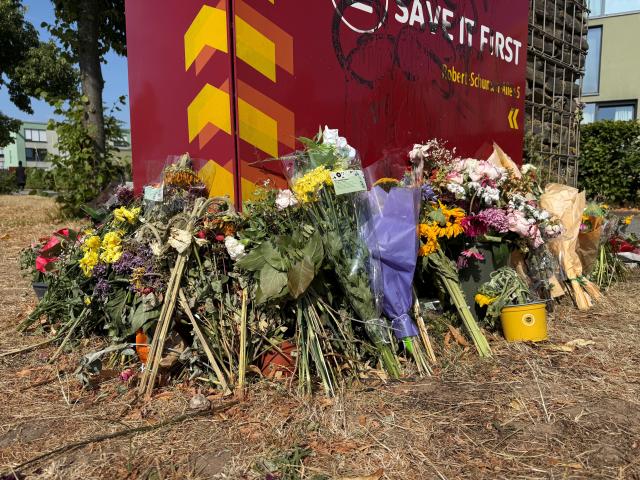 22 July 2026, Rhineland-Palatinate, Trier: Flowers have been laid at the spot where a student was stabbed to death a week ago. In recent days, two students at the University of Trier have been killed in violent incidents. Photo: Birgit Reichert/dpa