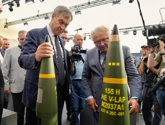 22 July 2026, Bavaria, Aschau A. Inn: Minister President of Bavaria Markus Soeder views military exhibits manufactured by the Rheinmetall AG alongside CEO of Rheinmetall AG Armin Papperger during the groundbreaking ceremony for the company's propellant plant. Photo: Uwe Lein/dpa