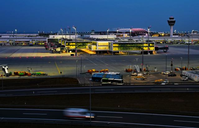 FILED - 02 March 2026, Bavaria, Munich: FILE PHOTO - Cars drive past Munich Airport at dusk. Photo: Malin Wunderlich/dpa