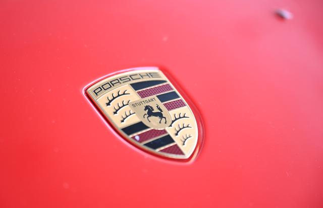 FILED - 18 July 2025, Baden-Württemberg, Stuttgart: FILE PHOTO - The Porsche logo is attached to the hood of a Porsche. Photo: Bernd Weißbrod/dpa