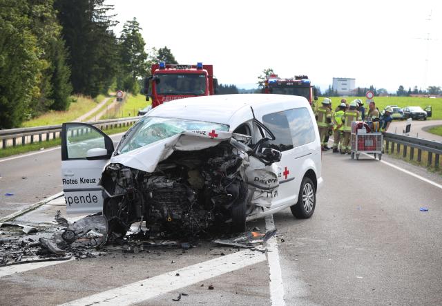 23 July 2026, Bavaria, Marktoberdorf: A Red Cross vehicle is parked on Federal Highway 12 (B12) at the scene of a traffic accident in Germany. Two people were killed in the crash. Photo: Karl-Josef Hildenbrand/dpa