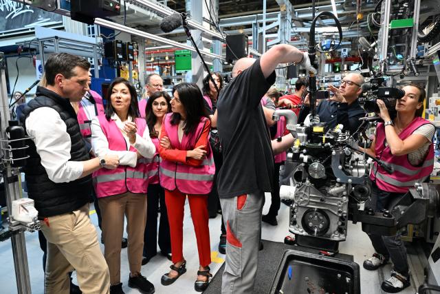 23 July 2026, North Rhine-Westphalia, Cologne: German Minister for Economic Affairs and Energy Katherina Reiche (2nd L) tours the engine production facility at Deutz AG with plant manager Oliver Huegele (L), as part of her summer visits. Photo: Federico Gambarini/dpa