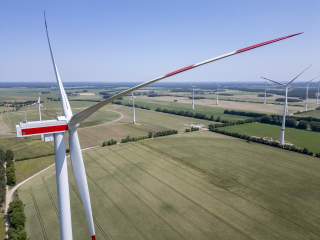 FILED - 12 June 2025, Saxony-Anhalt, Zahna-Elster: FILE PHOTO - An employee of Siemens Gamesa Renewable Energy inspects the weather station of a new Siemens Gamesa SG-6.6-155 wind turbine. Photo: Jan Woitas/dpa