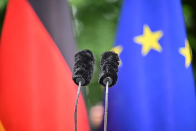 24 July 2026, Berlin: Two microphones are seen on a lectern ahead of a press conference at the German Chancellery on personnel changes in the government and the Christian Democratic Union (CDU). Photo: Sebastian Gollnow/dpa