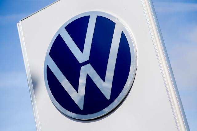 FILED - 20 March 2026, Lower Saxony, Emden: FILE PHOTO - The Volkswagen logo stands in front of the entrance to the automaker's plant. Photo: Hauke-Christian Dittrich/dpa
