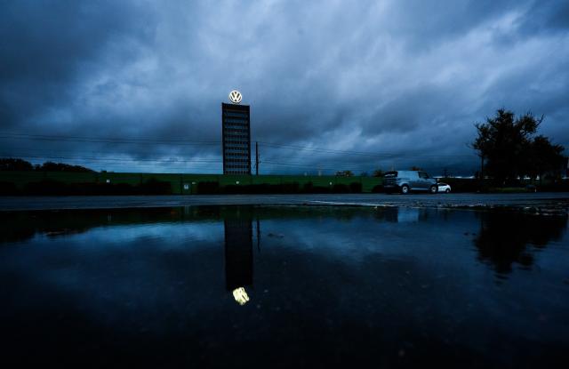 FILED - 30 October 2025, Lower Saxony, Wolfsburg: FILE PHOTO - Dark clouds gather over Volkswagen's Marken skyscraper on the grounds of the VW main plant. Photo: Julian Stratenschulte/dpa