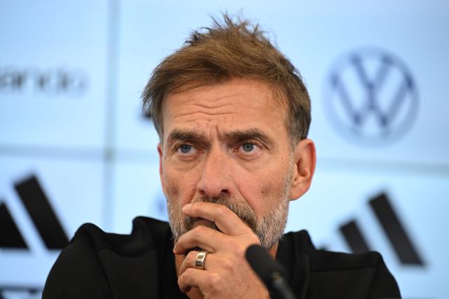 24 July 2026, Hesse, Frankfurt/Main: Juergen Klopp sits on the podium during a press conference to introduce the new national team head coach. Photo: Florian Wiegand/dpa