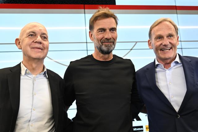 24 July 2026, Hesse, Frankfurt/Main: (L-R) Bernd Neuendorf, president of the German Football Association (DFB), Juergen Klopp and Hans-Joachim Watzke, DFB vice-president, stand on the podium at the start of a press conference to introduce the new national team head coach. Photo: Florian Wiegand/dpa