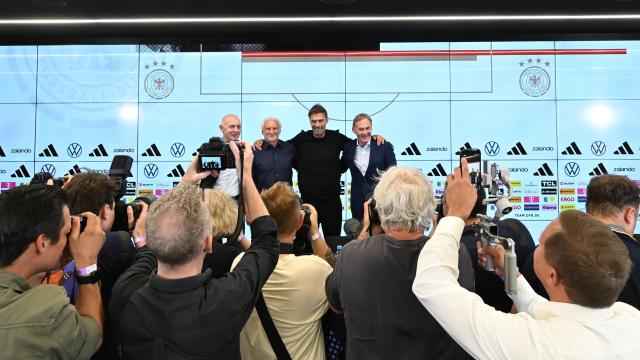 24 July 2026, Hesse, Frankfurt/Main: (L-R) Bernd Neuendorf, DFB president, Rudi Voeller, DFB sporting director, Juergen Klopp, the new Germany national team head coach, and Hans-Joachim Watzke, DFB vice-president, pose after a press conference following Klopp's introduction as the new Germany national team head coach. Photo: Jennifer Brückner/dpa