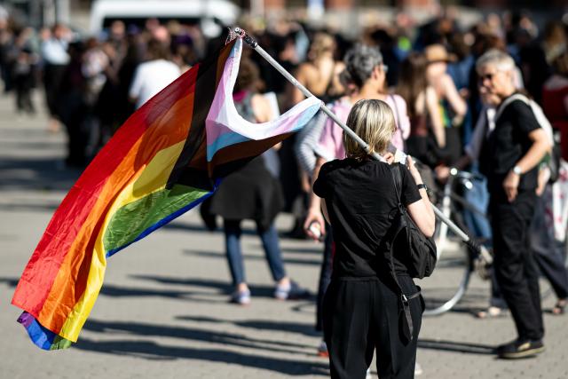 24 July 2026, Berlin: People take part in the Pride March in front of the Red City Hall in Berlin. Photo: Fabian Sommer/dpa