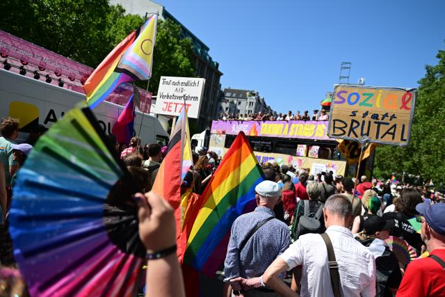 25 July 2026, Berlin: People demonstrate under the slogan "Attitude is Hot" during Christopher Street Day (CSD) in Berlin. For the first time, Berlin's CSD is taking place over two days. Photo: Fabian Sommer/dpa